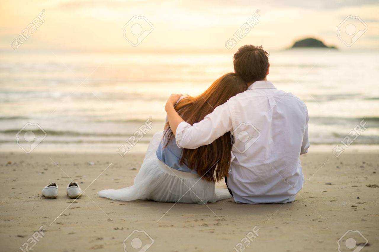 Couple Watching Sunset In The Beach Romantic Scene Stock Photo, Picture And Royalty Free Image. Image 74724868. Couple Watching Sunset In The Beach Romantic Scene Stock Photo, Picture And Royalty Free Image. Image 74724868.